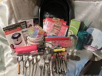 Overall view of lot with reusable bags, blender box, enamel roaster, flatware and accessories