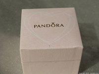 Closed light pink Pandora gift box