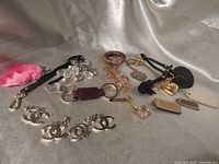 Group view of all keychains and charms laid on fabric