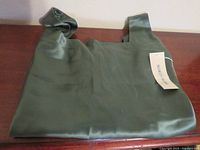 Folded silk top with retail tag attached