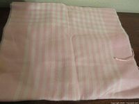 Full view folded pink check cashmere scarf