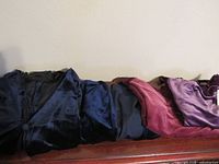 Folded velvet garments showing colors and textures
