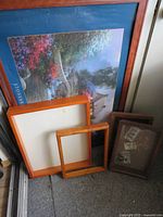 Group of prints, frames and shadow boxes leaning together