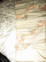 Close-up of pinch pleat header and floral pattern fabric