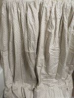 Front of both curtain panels showing overall fabric pattern and pleats