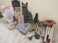 Full lot showing cat statues, stepping stone, lantern, wind chimes