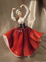Front view of Royal Doulton Karen figurine showing red skirt and pose