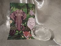 Paperweight front with carved tiger head and reference card