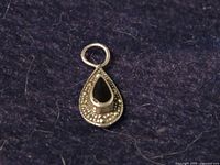 Front view showing amethyst stone, marcasite border, and jump ring