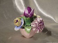 Front view showing flowers and pink pot