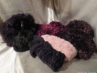 Group view of scarf, hat, earmuffs, and headbands