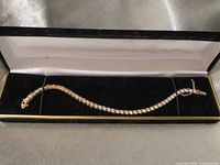 Bracelet inside open velvet box full view