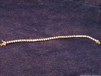Full view of straight-link tennis bracelet laid flat