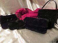 Group shot of four purses showing styles and materials