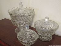 All three cut crystal covered candy dishes grouped
