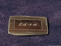 Front showing engraved initials and date