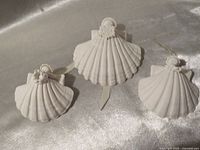 Three Margaret Furlong angel shell ornaments front view
