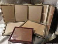 Group shot of all eight frames showing front and back