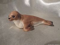 Left front view of porcelain seal figurine