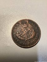 Reverse side showing crowned bank arms and ONE HALFPENNY legend