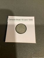 Coin in 2x2 flip, label visible