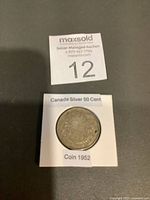 Coin in 2x2 holder labelled Canada Silver 50 Cent Coin 1952