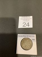 Front view of coin in holder showing design and date