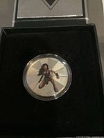 Coin in capsule inside presentation box