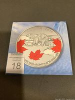 Obverse side showing polar bear and maple leaves, year and denomination