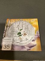 Front view of presentation card showing coin artwork