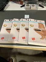 Four Hanes Solutions pantyhose packages front view