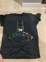 Full view of front of black Batman graphic T-shirt