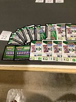 Spread of approximately twenty code cards showing both white and green styles