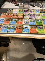 Full overhead view of all 40 Pokémon cards in 5×8 grid