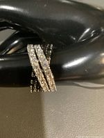 Front view showing criss-cross pavé rows on ring