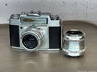 Front view of Agfa Ambi Silette camera with attached 50mm lens and separate telephoto lens