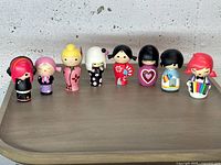 Front view of all nine Momiji dolls
