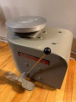 Front view showing turntable, lever, foot pedal