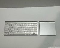 Apple wireless keyboard and Magic Trackpad side by side