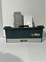 Front view of ArtBin toolbox with organiser case and palette standing behind