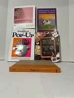 Front view of all five books showing covers