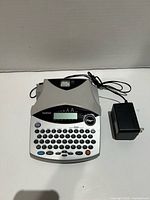 Top view of Brother P-Touch label maker with AC adapter