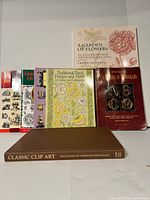 Front cover view of all seven books standing upright