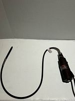 Overall view of Dremel rotary tool connected to flexible shaft