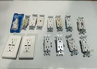 All electrical outlets, adapters and receptacles laid out on table