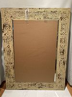 Full view of rectangular mirror showing entire frame and mirror glass
