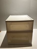 Front view of two stacked white translucent plastic storage containers