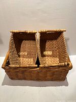 Large rectangular wicker basket with two smaller tapered baskets nested inside