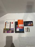 All items laid out: three paper pads, boxed pastel set, two small pastel packs