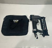 Ryobi brad nailer and carry case displayed side by side